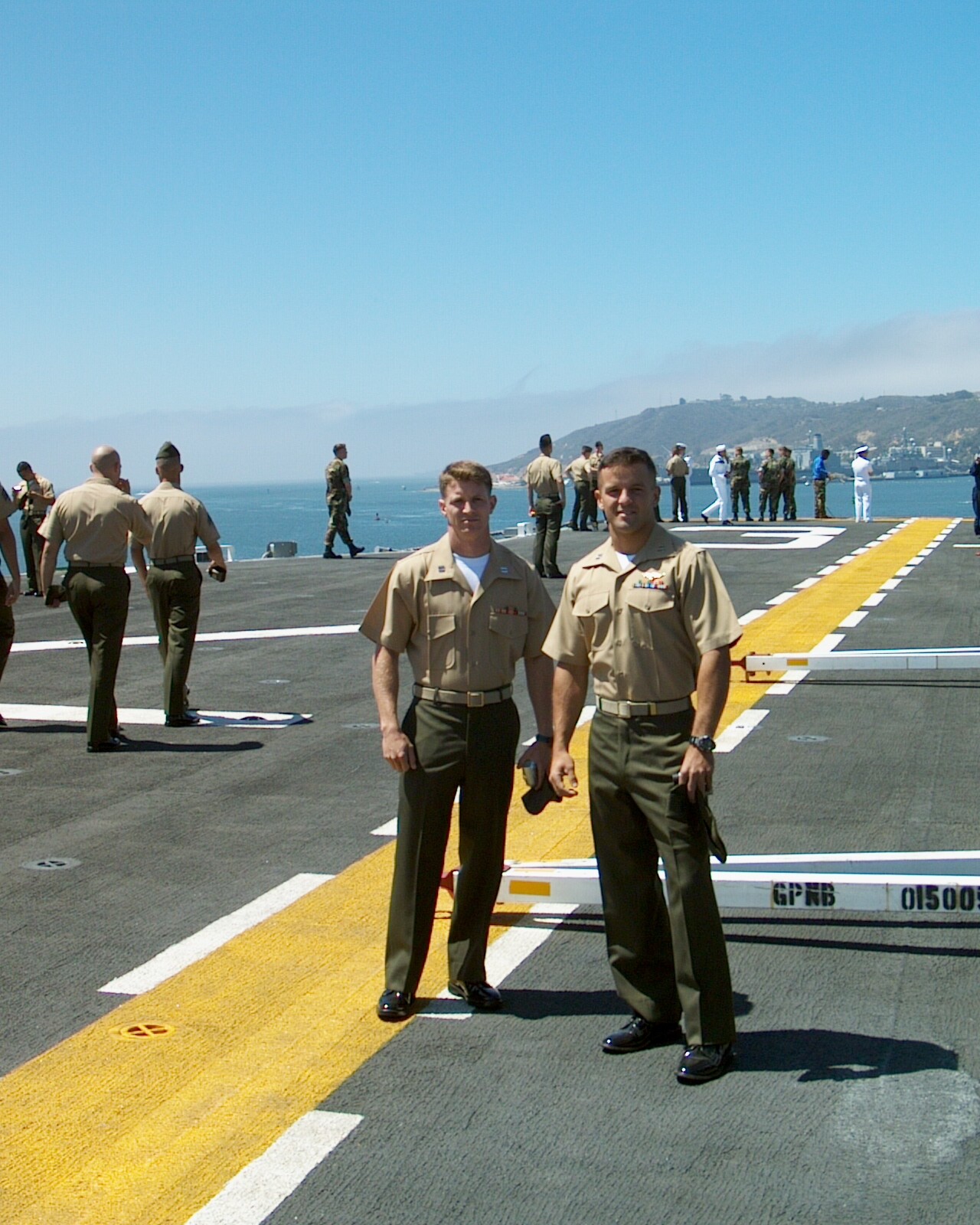 Gash (left) and I on the deck of the USS Belleau Wood as it pulls out of San Diego Harbor in 2002, about nine months before the invasion of Iraq.